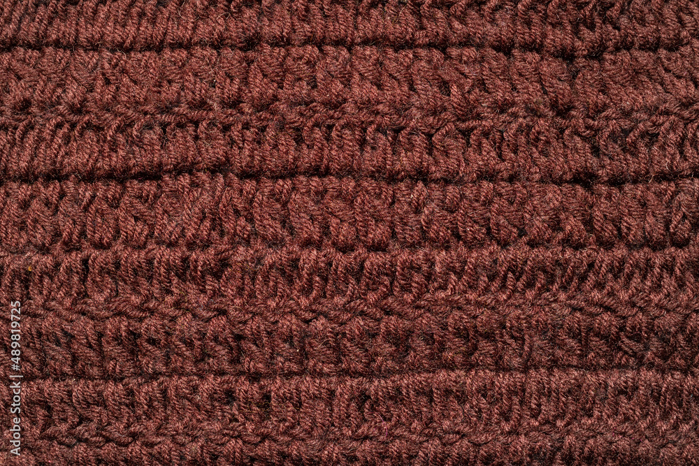 Knitted bright brown plaid textured.