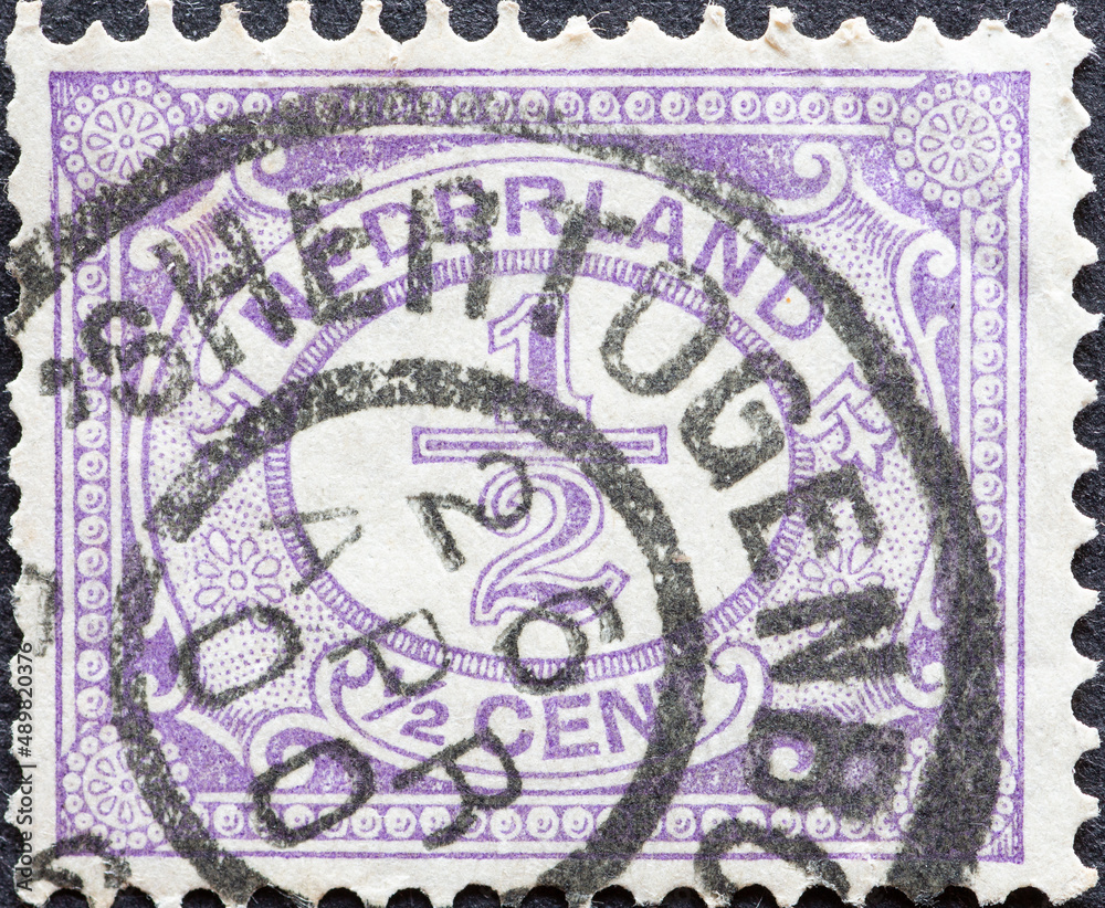 Netherlands - circa 1899 a postage stamp from the Netherlands , showing an ornament with number