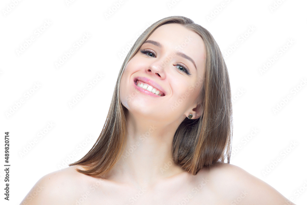 Photo of a young charming smiling girl who is pleased with herself and happy, isolated on a white background Photo of a young charming smiling girl who is pleased with herself and happy, isolated on a white background