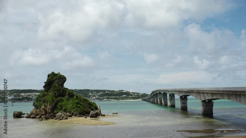 NAKIJIN VILLAGE, OKINAWA, JAPAN - AUGUST 2021 : View around Kouri beach (Ocean or sea) in daytime. Sunny summer holiday, vacation and resort concept video. NAKIJIN VILLAGE, OKINAWA, JAPAN - AUGUST 2021 : View around Kouri beach (Ocean or sea) in daytime. Sunny summer holiday, vacation and resort concept video.