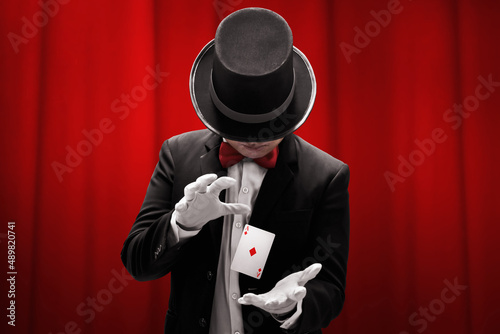 Magician hands showing magic trick photo
