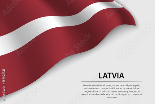 Wave flag of Latvia on white background. Banner or ribbon vector template photo