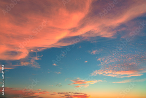 Fototapeta Naklejka Na Ścianę i Meble -  Sky at sunset texture background overlay. Dramatic orange clouds.