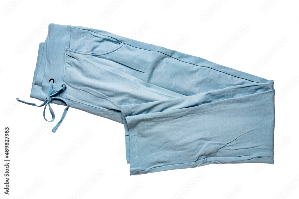 Sweat pants isolated. Close-up of womans fashionable blue casual trousers or jersey trousers isolated on a white background. Jogging outfit for workout. Clipping path. Sweat pants isolated. Close-up of womans fashionable blue casual trousers or jersey trousers isolated on a white background. Jogging outfit for workout. Clipping path.