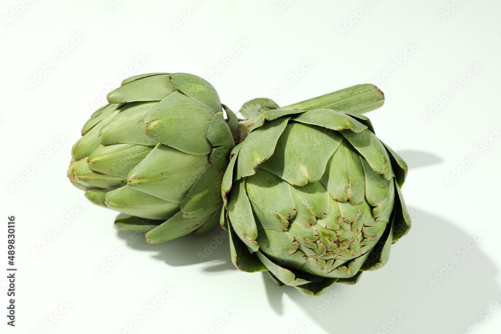 Fototapeta premium Concept of healthy food with artichoke on white background