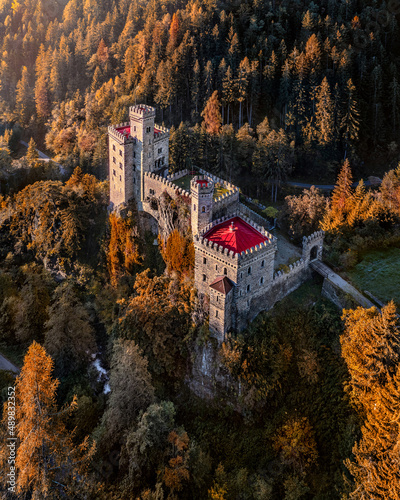 Latzfons, Italy - Aerial view of beautiful Gernstein Castle (Castello di Gernstein, Schloss Gernstein) at sunrise in South Tyrol at autumn photo