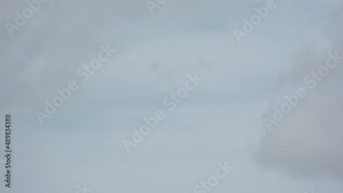 NAHA, OKINAWA, JAPAN - AUGUST 2021 : View of Naminoue beach (Ocean or sea) in daytime. Clear sunny sky and clouds. Wide view, real time shot. Summer holiday, vacation and resort concept video. photo