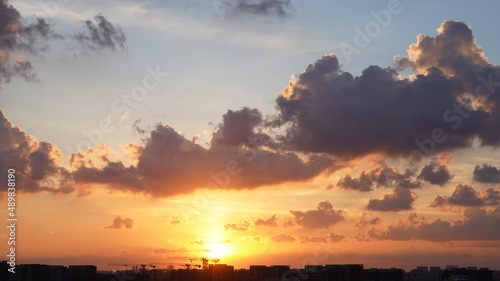 The beautiful sunset view with the colorful clouds and sky in the city