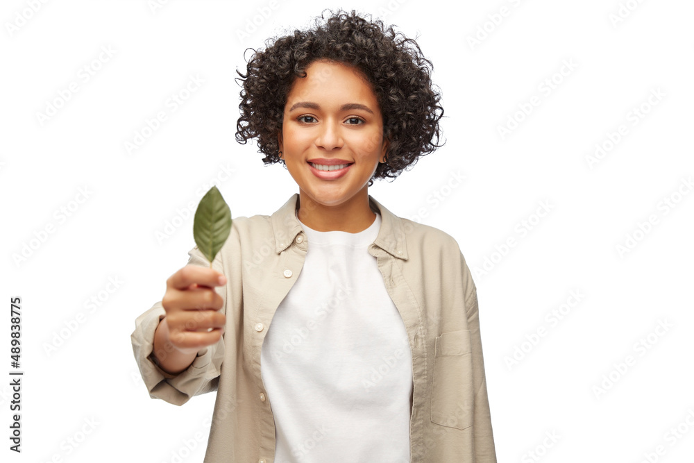 eco living, environment and sustainability concept - portrait of happy smiling woman holding green leaf over white background eco living, environment and sustainability concept - portrait of happy smiling woman holding green leaf over white background