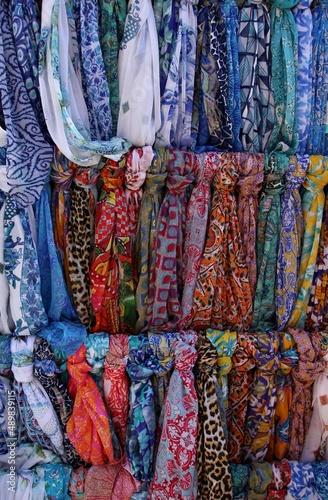 Italy, Sicily: Market of dresses and scarves.