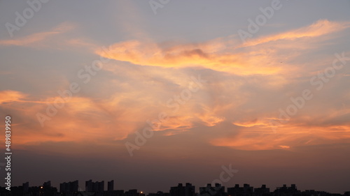 The beautiful sunset view with the colorful clouds and sky in the city