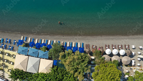 Aerial drone photo of picturesque seaside village and beach of Eratini in Fokida prefecture as seen in summer, Greece photo