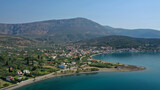Aerial drone photo of picturesque seaside village and beach of Eratini in Fokida prefecture as seen in summer, Greece