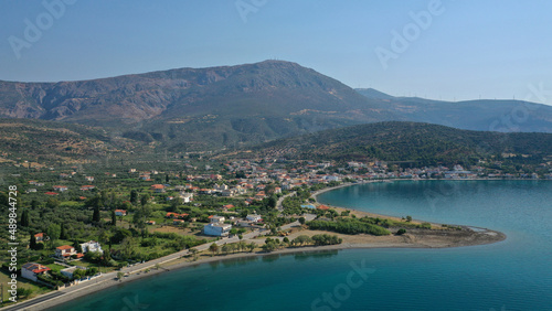 Aerial drone photo of picturesque seaside village and beach of Eratini in Fokida prefecture as seen in summer, Greece © aerial-drone
