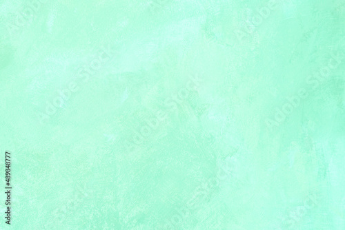 Mint colored abstract textured background. Decorative plaster on the wall
