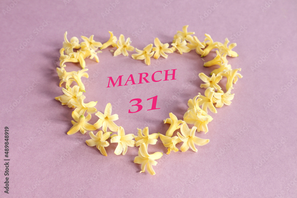 Φωτογραφία Calendar for March 31: number 31, the name of the month of March in English in a