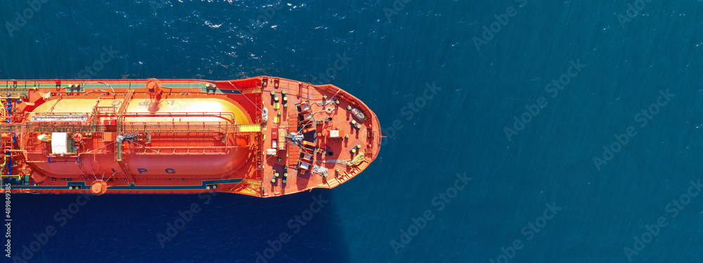 Aerial drone ultra wide top down photo of industrial LPG gas tanker ship anchored in deep blue sea - obrazy, fototapety, plakaty 
