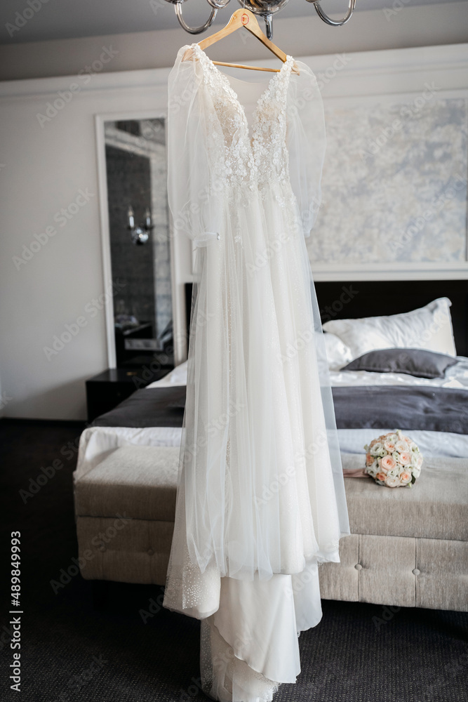 Wedding dress in a spacious room close up Wedding dress in a spacious room close up