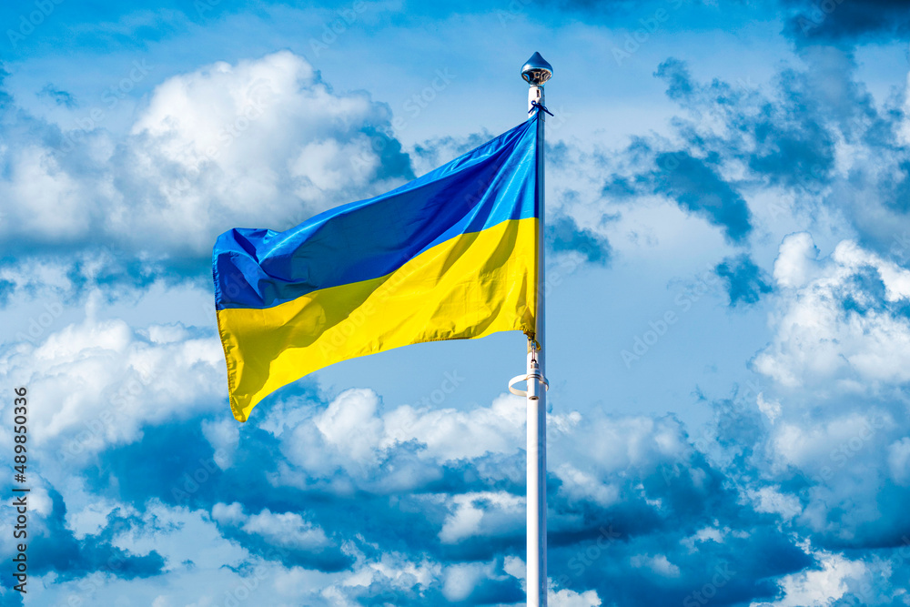Flag of Ukraine against the background of a cloudy sky Flag of Ukraine against the background of a cloudy sky