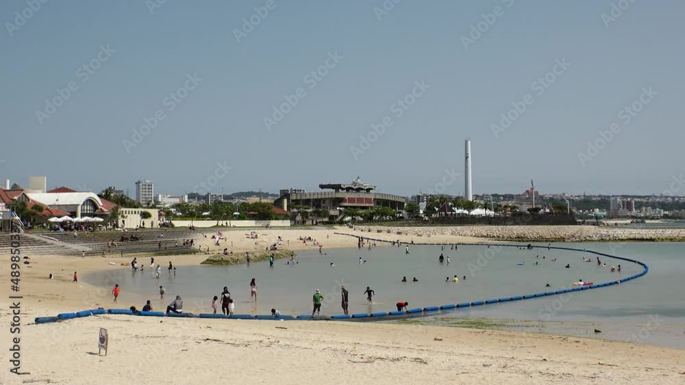 CHATAN-CHO, OKINAWA, JAPAN - AUGUST 2021 : View of Chatan sunset beach (Ocean or sea). Wide view, time lapse shot in daytime. Summer holiday, vacation and resort concept video.