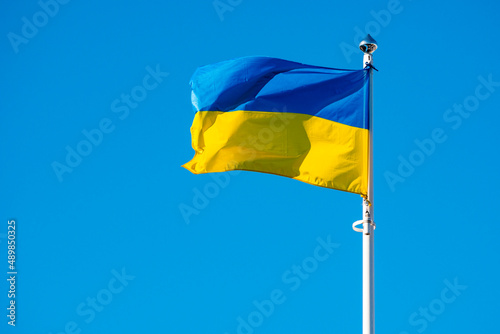 Flag of Ukraine against the background of a bright blue sky