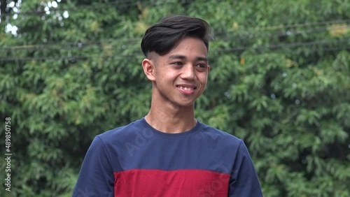 A Happy Agreeable Asian Male Outside
