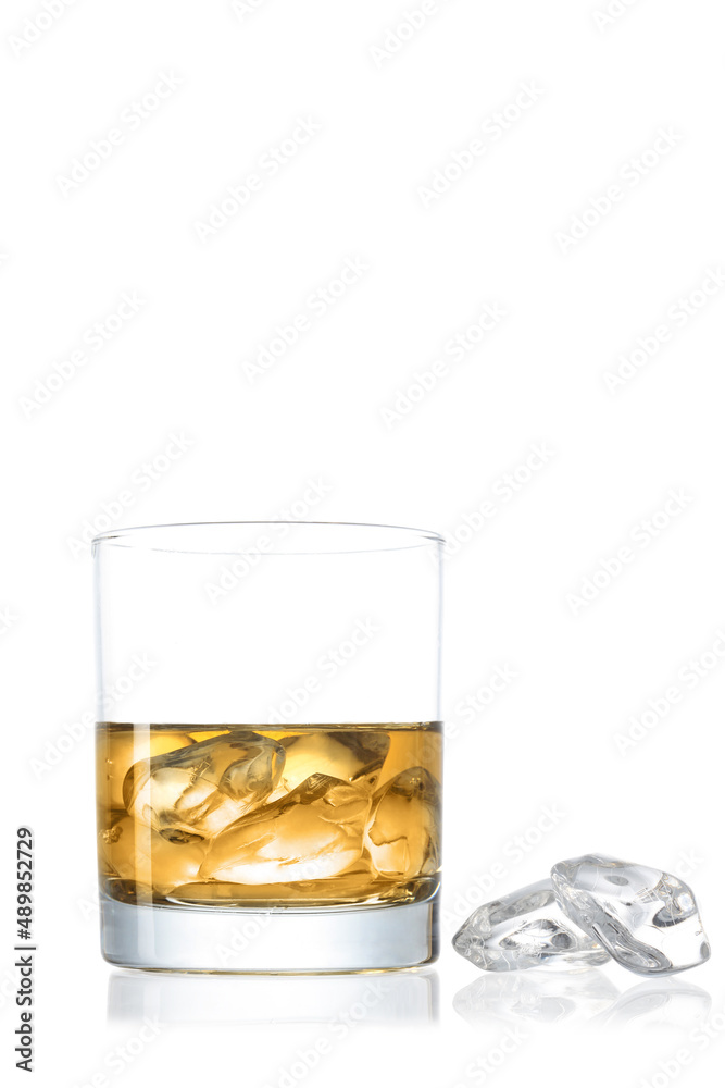 Whiskey glass with ice cubes isolated on white background with clipping path and copy space for your text Whiskey glass with ice cubes isolated on white background with clipping path and copy space for your text