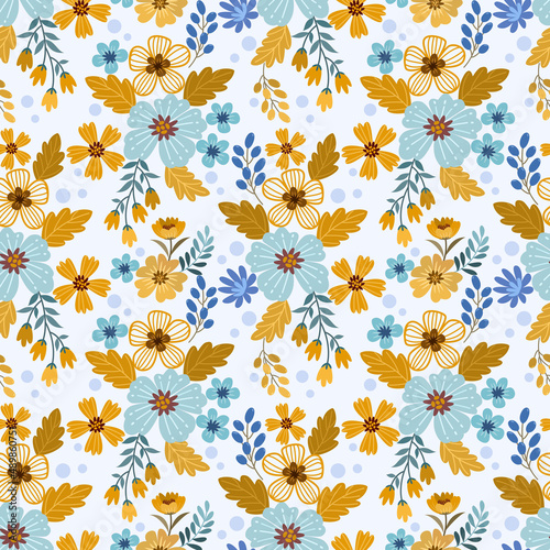 Cute small yellow and blue flowers seamless pattern for fabric textile wallpaper. © teerawat