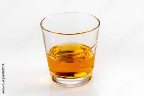 Glass of whiskey or whisky or bourbon or scotch, closeup isolated on white, clipping path