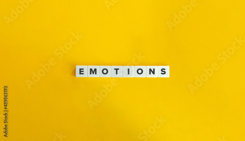 Emotions Word on Letter Tiles on Yellow Background. Minimal Aesthetics.