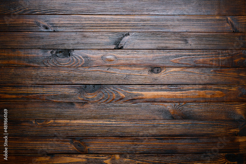 Rustic dark stained wooden table background texture top view