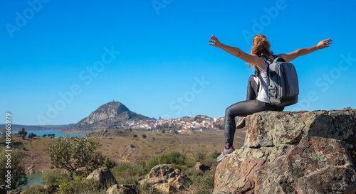 woman arms raised on the top of mountain- Spain