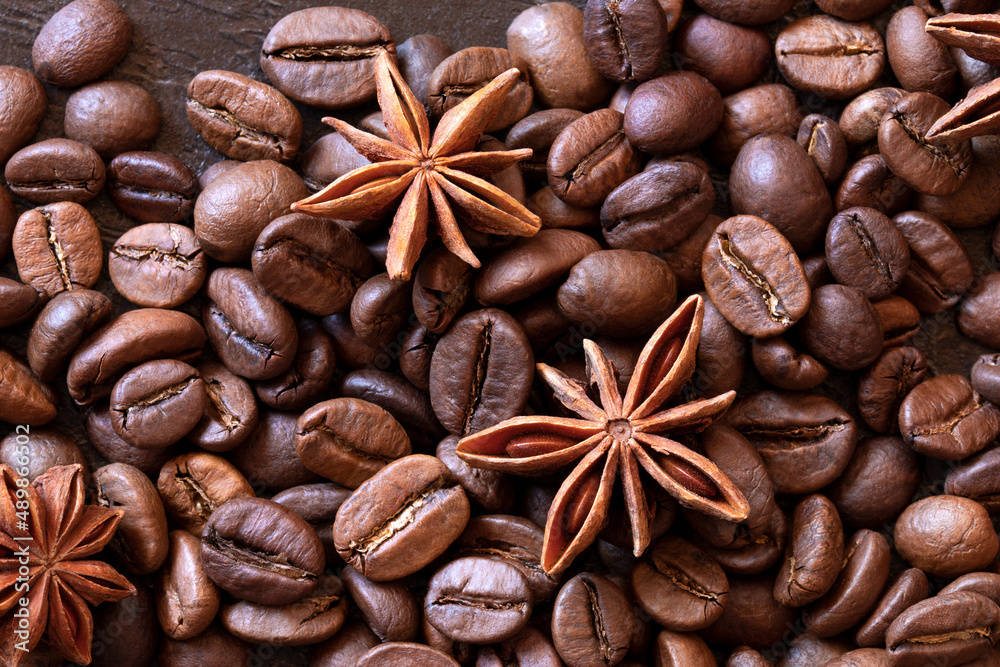 coffee beans with star anise flowers close-up. view from above