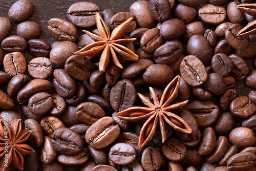 coffee beans with star anise flowers close-up. view from above