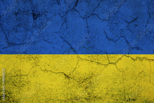 Ukrainain flag on a textured wall, national idendity, war crisis between Ukraine and Russia, political issue