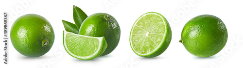 Whole and sliced limes isolated on white background. Fresh limes collection.