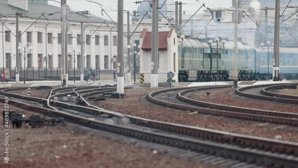Old electric train moving by rail. Outdated design. Soviet electric train traveling. Transportation concept. Old diesel vehicle travels along the railway line. Suburban passenger transportation. Old electric train moving by rail. Outdated design. Soviet electric train traveling. Transportation concept. Old diesel vehicle travels along the railway line. Suburban passenger transportation.