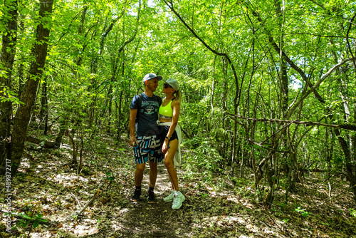 A man with a girl in the forest near the cave town of Tepe-Kermen Crimea Russia 2021 © Виктория Балобанова