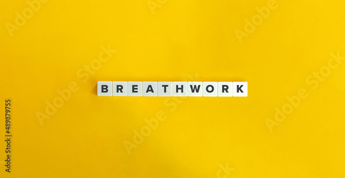 Breathwork Buzzword on Letter Tiles on Yellow Background. Minimal Aesthetics.