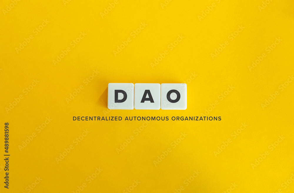 Decentralized Autonomous Organizations (DAO) Banner. Letter Tiles on Yellow Background. Minimal Aesthetics. - obrazy, fototapety, plakaty 