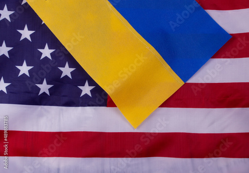 Flags of the USA, Russia, Ukraine with gun on the background . Peace concept