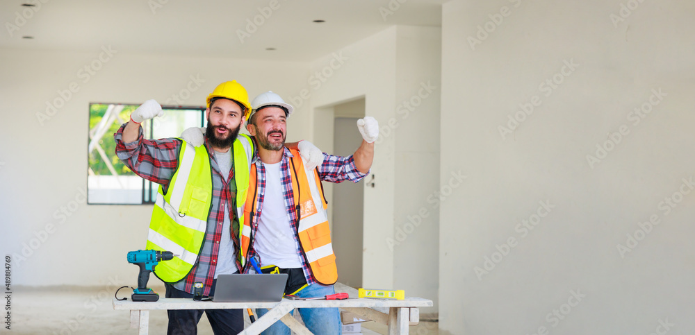 handshake. Electrician and construction engineer man team in safety uniform working and planing in construction site. handshake. Electrician and construction engineer man team in safety uniform working and planing in construction site.