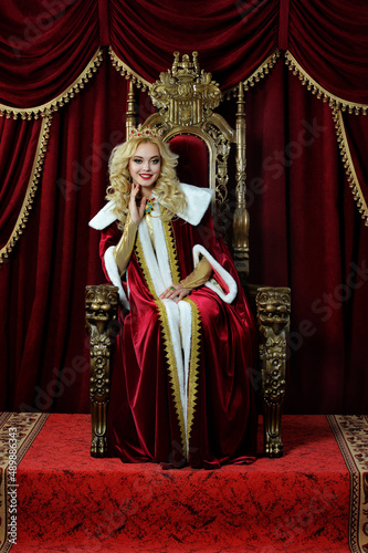 portrait of queen with crown on chair