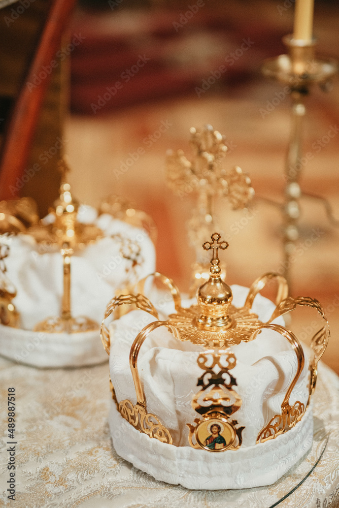 Pair of golden crowns n the church. Orthodox religious crowns.