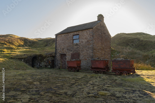 carts outside an old mining building near Nenthead in Cumbria, UK photo