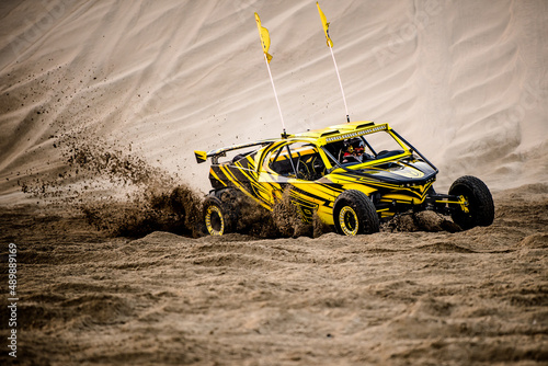 Fototapeta Naklejka Na Ścianę i Meble -  Doha,Qatar,February 23, 2018: Off road buggy car in the sand dunes of the Qatari desert.