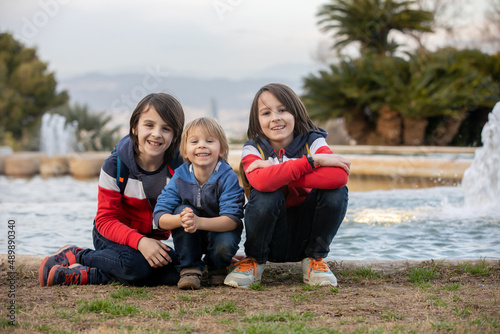 Photography Cute little children tourists admiring Barcelona city, family travel with kids