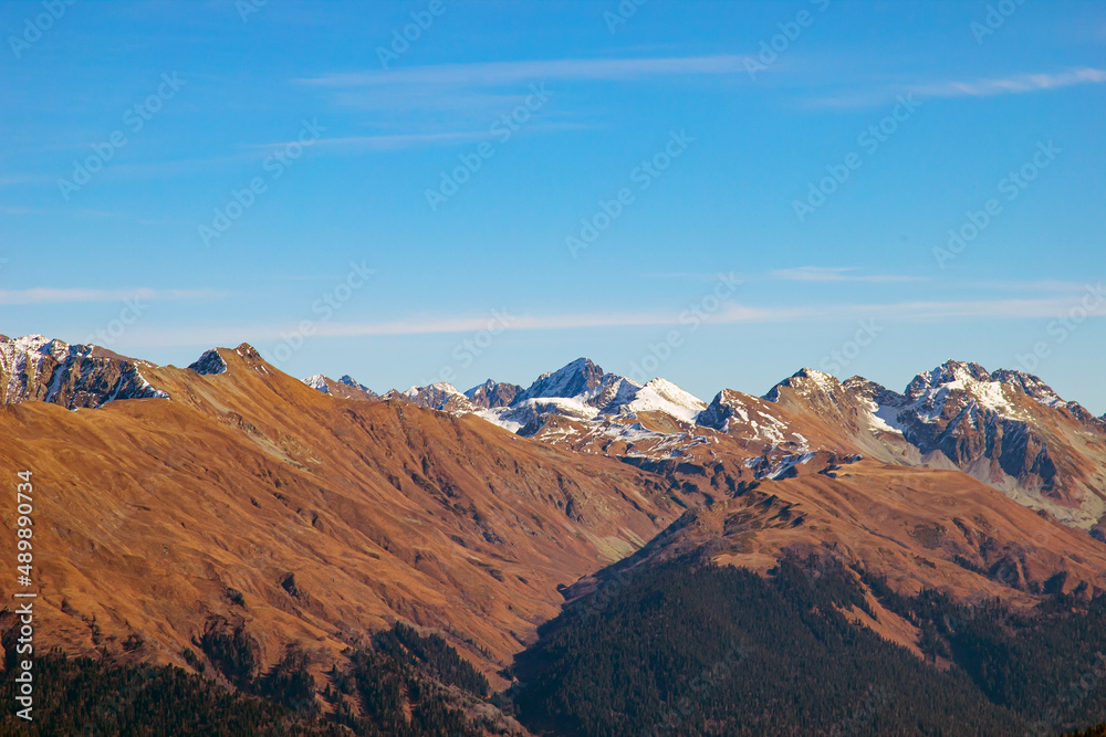 A magnificent mountain landscape with rocks against a clear blue sky. A tourist destination for lovers of hiking in the mountains
