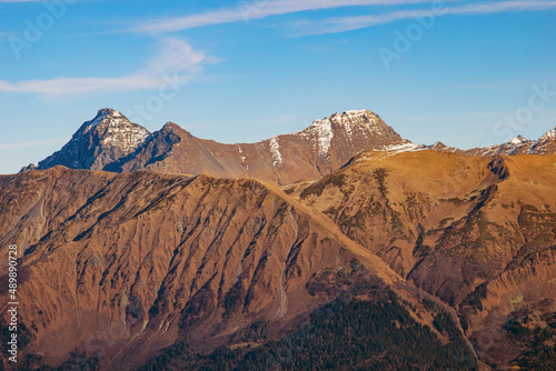 A magnificent mountain landscape with rocks against a clear blue sky. A tourist destination for lovers of hiking in the mountains