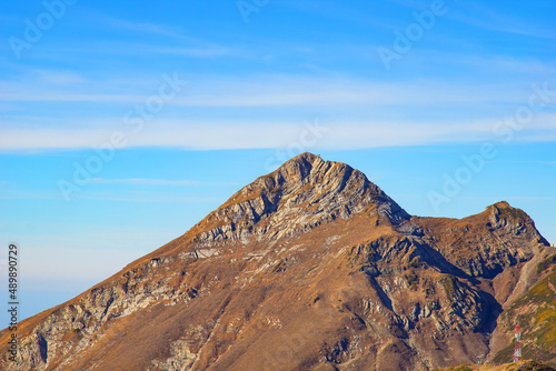 A magnificent mountain landscape with rocks against a clear blue sky. A tourist destination for lovers of hiking in the mountains